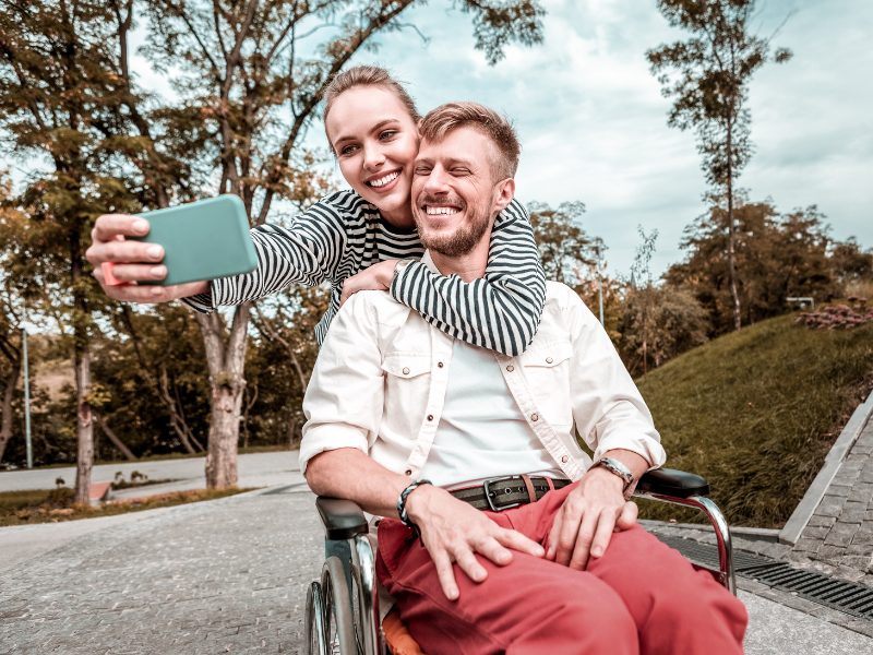A couple taking a selfie together outdoors